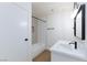 This bathroom has a tiled shower and tub, modern fixtures, and a single sink vanity at 3770 Shirebrook Dr # 160, Las Vegas, NV 89115