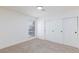 This bedroom has neutral carpet, a large window, and a closet with sliding doors at 3770 Shirebrook Dr # 160, Las Vegas, NV 89115