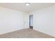 This empty bedroom features neutral carpet and white walls and doors at 3770 Shirebrook Dr # 160, Las Vegas, NV 89115