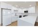 Well-lit kitchen with stainless steel appliances, a large refrigerator, and sleek white countertops at 3770 Shirebrook Dr # 160, Las Vegas, NV 89115