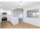 Bright kitchen with a modern oven, white cabinets, and a large window over the sink at 3770 Shirebrook Dr # 160, Las Vegas, NV 89115