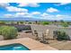 Secluded backyard seating area with views and a sparkling pool that enhances outdoor living at 392 Waterwheel Falls Dr, Henderson, NV 89015