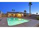 Backyard pool with patio, swing, and palm trees, perfect for relaxing and entertaining at 392 Waterwheel Falls Dr, Henderson, NV 89015