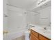 Well-lit bathroom with a tub, toilet, vanity, and mirror featuring modern fixtures at 392 Waterwheel Falls Dr, Henderson, NV 89015