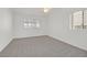 Bedroom featuring plush carpet, neutral walls, natural light and a ceiling fan at 392 Waterwheel Falls Dr, Henderson, NV 89015