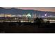 Stunning Las Vegas skyline view at night with mountains in the background, showcasing city lights at 392 Waterwheel Falls Dr, Henderson, NV 89015
