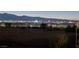 Wide Las Vegas skyline view at night featuring colorful lights, casinos, and distant mountains at 392 Waterwheel Falls Dr, Henderson, NV 89015