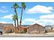 Charming single-story home with a three-car garage and desert landscaping at 392 Waterwheel Falls Dr, Henderson, NV 89015