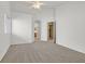 Spacious main bedroom featuring neutral walls, plush carpet and arched doorways at 392 Waterwheel Falls Dr, Henderson, NV 89015