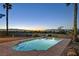 Inviting backyard pool and patio area overlooking the city skyline at 392 Waterwheel Falls Dr, Henderson, NV 89015