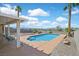 Inviting pool with a patio and desert landscaping creates a backyard oasis at 392 Waterwheel Falls Dr, Henderson, NV 89015