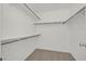 Walk-in closet offers shelving, railing and carpeted flooring at 392 Waterwheel Falls Dr, Henderson, NV 89015