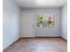 A spare bedroom is bright with a window, iron bars and tile floors at 4000 Visby Ln, Las Vegas, NV 89119