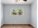 Bright bedroom features a window with iron bars and neutral wall color at 4000 Visby Ln, Las Vegas, NV 89119