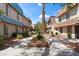 Townhouse exteriors feature desert landscaping and concrete walkways for easy access to each unit at 4000 Visby Ln, Las Vegas, NV 89119