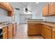 Functional kitchen with light wood cabinetry, a breakfast bar, and double sink at 4000 Visby Ln, Las Vegas, NV 89119