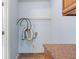 Simple laundry room with countertop and shelf at 4000 Visby Ln, Las Vegas, NV 89119