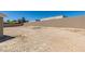 Spacious backyard area with potential for landscaping and outdoor recreation, featuring a block wall for privacy at 4255 Breezy Point Ln, Las Vegas, NV 89115
