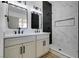 Modern bathroom featuring a double sink vanity, updated fixtures, and tiled shower at 4255 Breezy Point Ln, Las Vegas, NV 89115