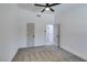 Bedroom featuring carpet, a ceiling fan and two doors at 4255 Breezy Point Ln, Las Vegas, NV 89115