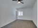 Bedroom featuring carpet, a window and a ceiling fan at 4255 Breezy Point Ln, Las Vegas, NV 89115