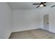 Bedroom featuring carpet, a ceiling fan and a door at 4255 Breezy Point Ln, Las Vegas, NV 89115