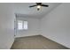 Bedroom featuring carpet, a window and a ceiling fan at 4255 Breezy Point Ln, Las Vegas, NV 89115