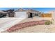 Charming single-story home features a low maintenance xeriscaped front yard and a two car garage at 4255 Breezy Point Ln, Las Vegas, NV 89115