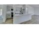Kitchen with gray shaker cabinets, stainless appliances and large island at 4255 Breezy Point Ln, Las Vegas, NV 89115
