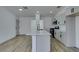 Modern kitchen features an island with quartz countertop and stainless steel appliances at 4255 Breezy Point Ln, Las Vegas, NV 89115