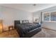 Bedroom features a modern bed, plush carpet, and vanity with lighted mirror at 508 Purcell Dr, Las Vegas, NV 89107