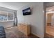 Bedroom with flat screen TV, dresser and plush carpet at 508 Purcell Dr, Las Vegas, NV 89107