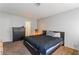 Bedroom with plush carpet, black dresser and lit floor lamp at 508 Purcell Dr, Las Vegas, NV 89107