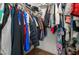 Walk-in closet featuring hanging clothes and storage at 508 Purcell Dr, Las Vegas, NV 89107
