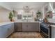 Well-lit kitchen featuring stainless steel appliances, gray cabinets, and modern fixtures at 508 Purcell Dr, Las Vegas, NV 89107