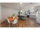 Open kitchen and dining area features breakfast bar, stainless appliances and tile floors at 508 Purcell Dr, Las Vegas, NV 89107