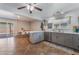 Open kitchen with an island, stainless steel appliances, and an adjacent dining area with sliding door access at 508 Purcell Dr, Las Vegas, NV 89107