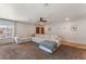 Spacious living area featuring plush carpeting, a modern ceiling fan, and a comfortable sectional sofa at 508 Purcell Dr, Las Vegas, NV 89107