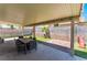 Covered patio space with outdoor dining set, seamlessly connecting indoor comfort with outdoor relaxation at 508 Purcell Dr, Las Vegas, NV 89107