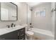 Updated bathroom with modern fixtures, vanity, and tiled shower over tub at 5245 Hillman Ave, Las Vegas, NV 89142