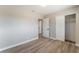 Bright bedroom with wood-look floors, closet, and neutral paint at 5245 Hillman Ave, Las Vegas, NV 89142