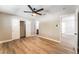Bright bedroom with ceiling fan, closet, and wood-look flooring at 5245 Hillman Ave, Las Vegas, NV 89142