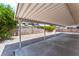 This backyard features a spacious carport with an adjacent block fence at 5245 Hillman Ave, Las Vegas, NV 89142