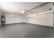 Spacious two-car garage with epoxy flooring and white walls at 5245 Hillman Ave, Las Vegas, NV 89142
