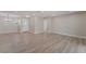 Spacious living room with wood-look floors, neutral paint, and recessed lighting at 5245 Hillman Ave, Las Vegas, NV 89142