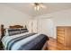 Bedroom with hardwood floors, ceiling fan, large closet, and natural light at 5401 Bugle Way # 103, Las Vegas, NV 89108