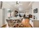 Open concept dining room with hardwood floors and natural light at 5401 Bugle Way # 103, Las Vegas, NV 89108