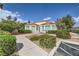 Charming single-story home featuring a tile roof, well-maintained landscaping, and inviting curb appeal at 5401 Bugle Way # 103, Las Vegas, NV 89108