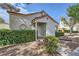 Attractive stucco home with a tiled roof and meticulously trimmed hedges at 5401 Bugle Way # 103, Las Vegas, NV 89108