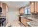 Efficient kitchen layout with granite countertops and modern appliances at 5401 Bugle Way # 103, Las Vegas, NV 89108